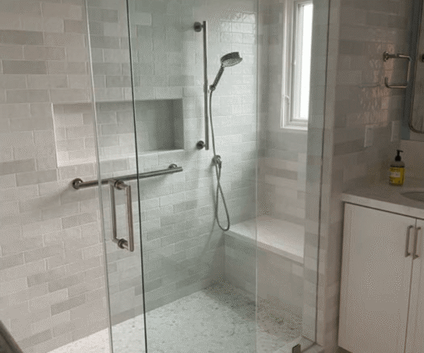 A sparkling glass shower professionally cleaned in Austin, TX by Pure Magic Maids.