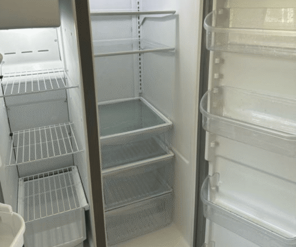 A sparkling clean refrigerator interior professionally cleaned in Austin, TX by Pure Magic Maids.