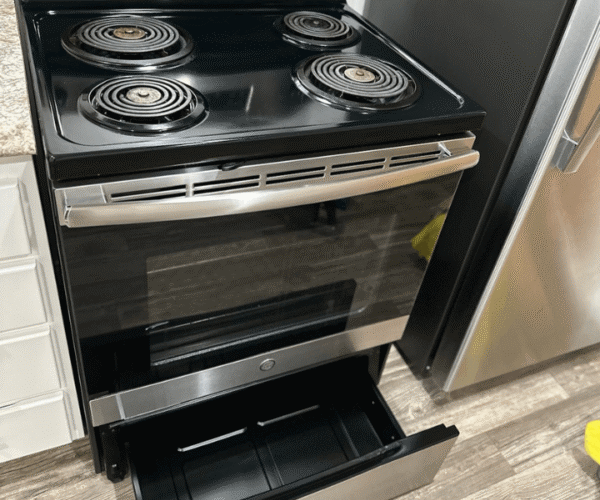 A sparkling stove after a professional kitchen cleaning in Austin, TX by Pure Magic Maids.