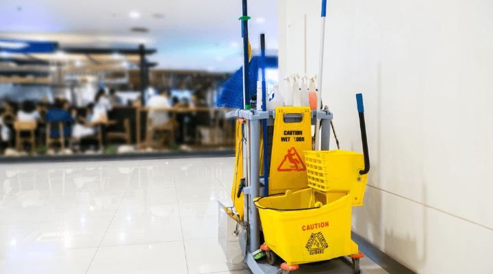 A janitor cart stocked with supplies for day porter cleaning in Austin, TX.