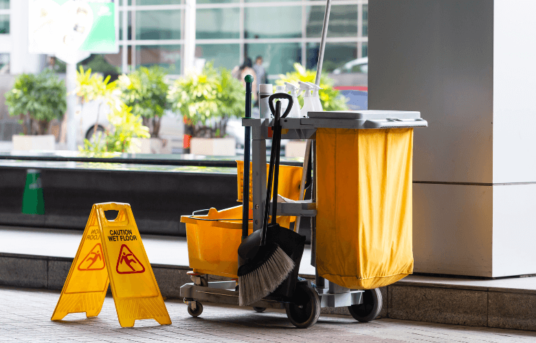 A janitor’s cart stocked with cleaning supplies for professional janitorial services in Austin, TX.