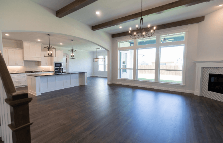 A spotless living room and kitchen after a professional move-out cleaning in Austin, TX.